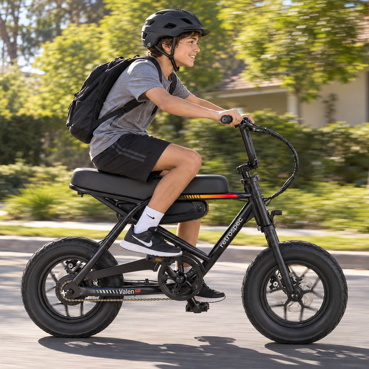 Retrospec Valen Rev 14 electric bike — rider lifestyle photo